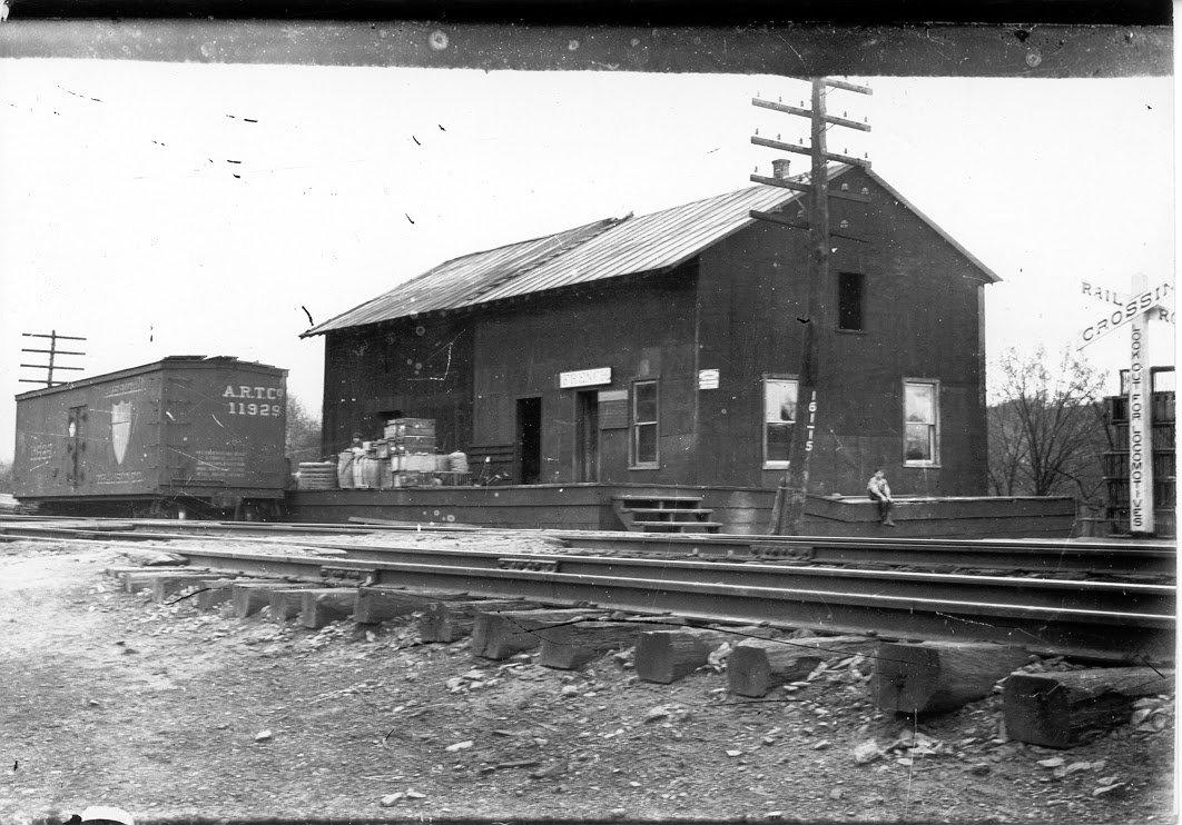 Archival photo of the original rail depot and a boxcar at Frenches Station.