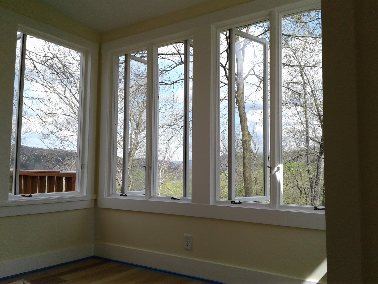 Picture windows in the loft looking out over the bare-branched valley toward the mountains.