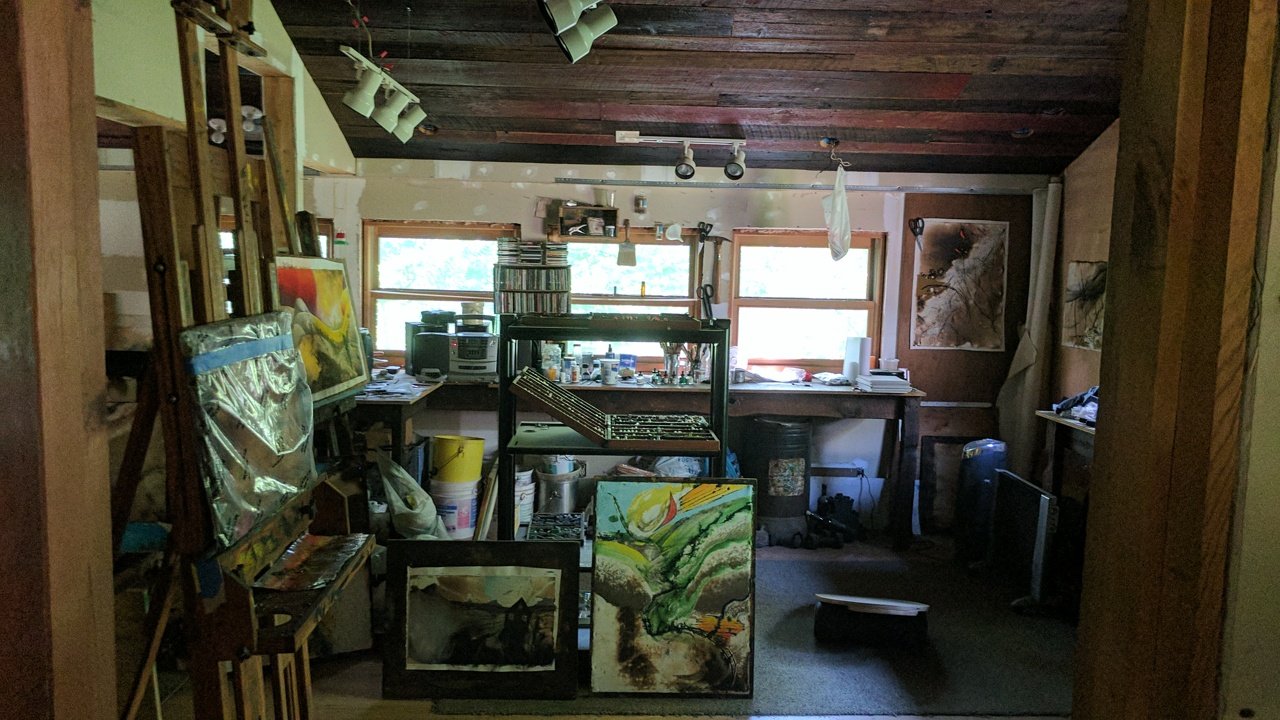 Exterior of the reconstructed cattle barn, now an art studio, clad in antique barn siding.